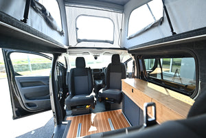 Electric camper interior with swivel front seats